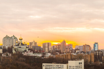 Wall Mural - Ukraine, Kyiv – November 26, 2016: Aerial panoramic view on central part of Kyiv city, residential area at sunset. Stunning sunset, golden hour. Lukianivska area. City silhouettes. 