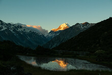 Last Light On Aoraki Mount Cook At Sunset With Reflection On The Water, Red Tarns Track, South Island Of New Zealand