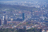 Fototapeta Miasto - Panoramic view from local mountain Uetliberg over City of Zürich on a blue cloudy spring day. Photo taken April 14th, 2022, Zurich, Switzerland.