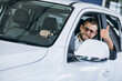 © Petro - Young man sitting in a new car in a showroom