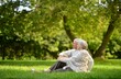 © aletia2011 - Portrait of happy senior couple sitting in autumn park