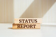 Wooden blocks with words 'Status Report'. Business concept