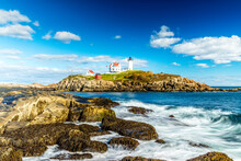 The Nubble Point Lighthouse On Cape Neddick, Maine