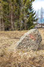Border Stone Marks The Border Between USSR And Finland. Roughly Hewn Stone Of Pink Ladoga Granite. Text Is Engraved On Stone: USSR - From East Side. SUOMI - On The West Side, Date 1934 And Number 263