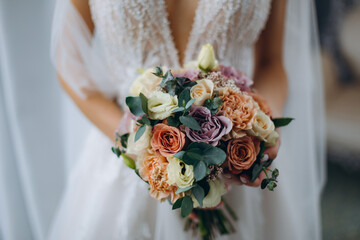 Wall Mural - wedding bouquet in the hands of the bride