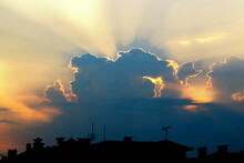 Sunrise/sunset Sky With Dramatic Clouds Over Residential Buildings