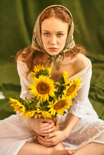 A Girl With Sunflowers