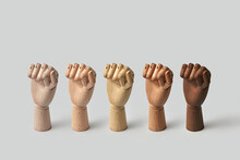 Various Wooden Mannequin Hands Clenched Into Fists