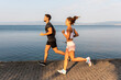 © STUDIO TAURUS/Stocksy - Couple Doing Cardio Outdoors