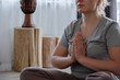 © Milles Studio/Stocksy - Crop woman meditating with prayer hands