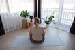 © Milles Studio/Stocksy - Woman meditating in weekend morning