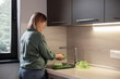 © Milles Studio/Stocksy - Woman washing ingredients for vegetable salad