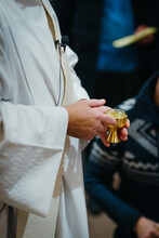 Priest Holding A Holy Communion Cup