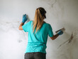 © Duet Postscriptum/Stocksy - Portrait of woman plasterer at work