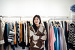 © ZQZ Studio/Stocksy - Portrait of clothing store owner