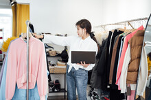 Young Woman Working In Her Clothing Store