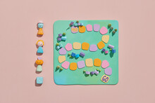 Pastel Color Handmade Chips And Dice On Board Games For Children.