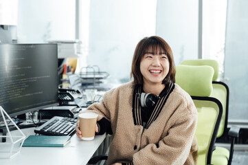 Young business woman smiling in office