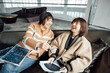 © ZQZ Studio/Stocksy - Two casual businesswoman talking in office