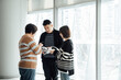 © ZQZ Studio/Stocksy - Casual business people talking in office