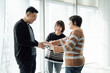 © ZQZ Studio/Stocksy - Casual business people talking in office