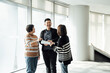 © ZQZ Studio/Stocksy - Casual business people talking in office