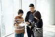 © ZQZ Studio/Stocksy - Casual business people talking in office