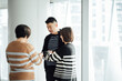 © ZQZ Studio/Stocksy - Casual business people talking in office