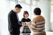 © ZQZ Studio/Stocksy - Casual business people talking in office