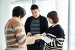© ZQZ Studio/Stocksy - Casual business people talking in office
