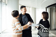 © ZQZ Studio/Stocksy - Casual business people talking in office