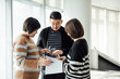 © ZQZ Studio/Stocksy - Casual business people talking in office
