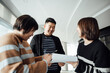 © ZQZ Studio/Stocksy - Casual business people talking in office