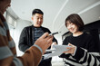 © ZQZ Studio/Stocksy - Casual business people talking in office