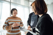 © ZQZ Studio/Stocksy - Casual business people talking in office