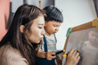 © Heng Yu/Stocksy - Mother teaching her little baby boy drawing