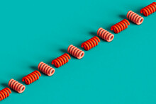 A Row Of Red Spirals On A Blue Background