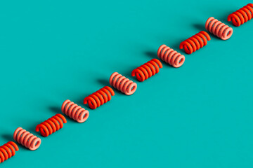 a row of red spirals on a blue background