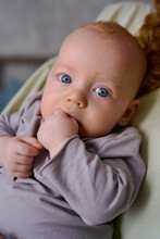 Portrait Of A Newborn Boy With Blue Eyes
