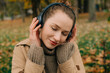 © Olga Moreira/Stocksy - Close up portrait of a woman enjoying music