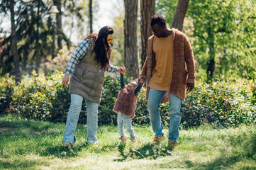 Wall Mural - Multiracial family having fun in the park