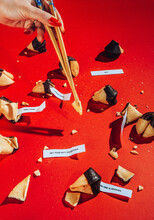 Fortune Cookies In Mess On Red Background.