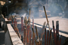 Burning Incense Sticks At A Temple In Xishuangbanna, Yunnan, China.