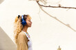 © Michela Ravasio/Stocksy - Profile woman with headphones