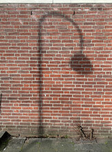 Shadow Of Lamppost And Tree On Wall