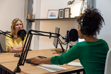 Happy Diverse Radio Hosts Recording Podcast In Studio