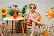 © Melissa Milis Photography/Stocksy - Girl  wearing flower sunglasses and looking super happy