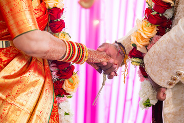 Indian couple's holding hands close up