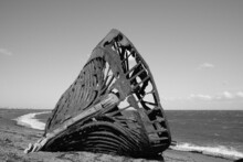 Remains Of An Old Ship On The Beach