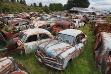 Ruined Classic Cars At A Dumping Yard